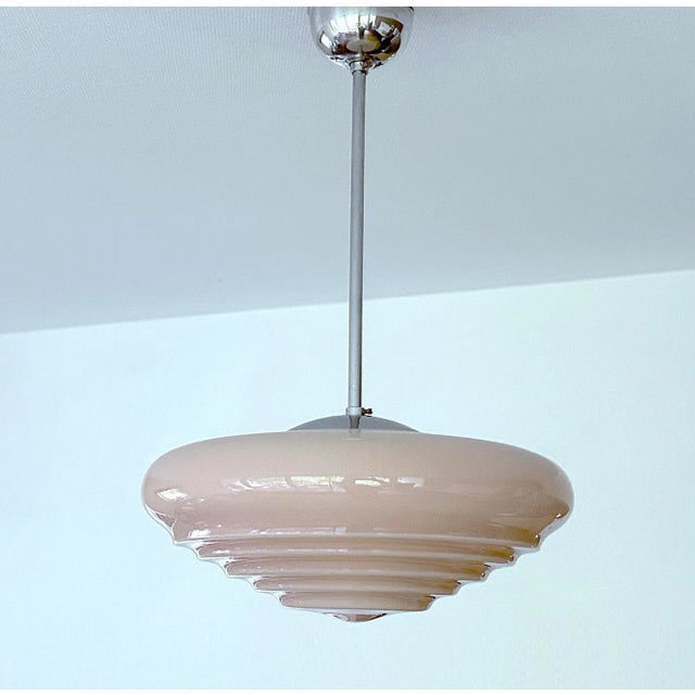 Art Deco pendant light with pink stepped glass shade , chrome suspension Very good condition, fully rewired with ground...