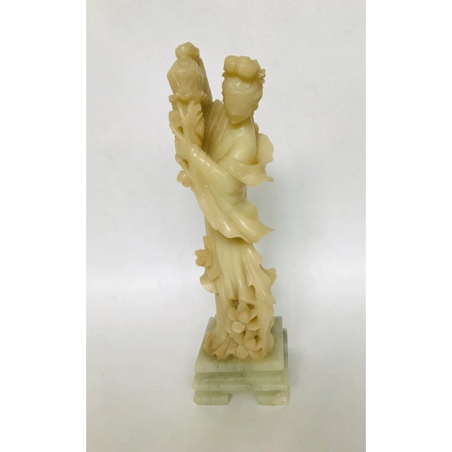 Flying scarves on a lady indicates by tradition that she is a heavenly being, an immortal, or a fairy. By her hairstyle...