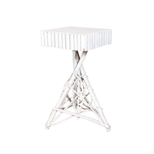 Hand-made twig folk art table. Square top and tripod legs. Embellished with cut and bentwood sticks.