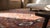 Masterly Handmade Red Background With Brown Border Medallion-Crest Design Antique Persian Rug For Sale - Image 9 of 11