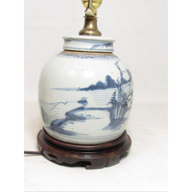 Antique Chinese porcelain ginger jar lamp, c.1900 Hand decorated in blue and white with a lakeside scene on the front with...