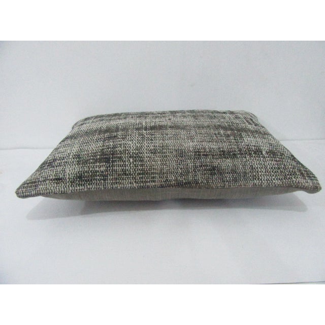 Decorative pillow cover made from a vintage Turkish handknotted rug. Backed with good quality cotton fabric. Pillow...