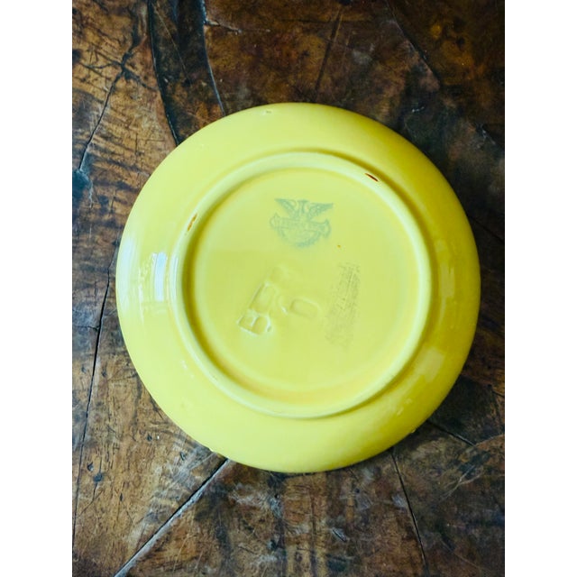 A wonderful small vintage Italian bowl by Società Ceramica Italiana (S.C.I.) of Laveno, featuring a cheerful yellow ground...