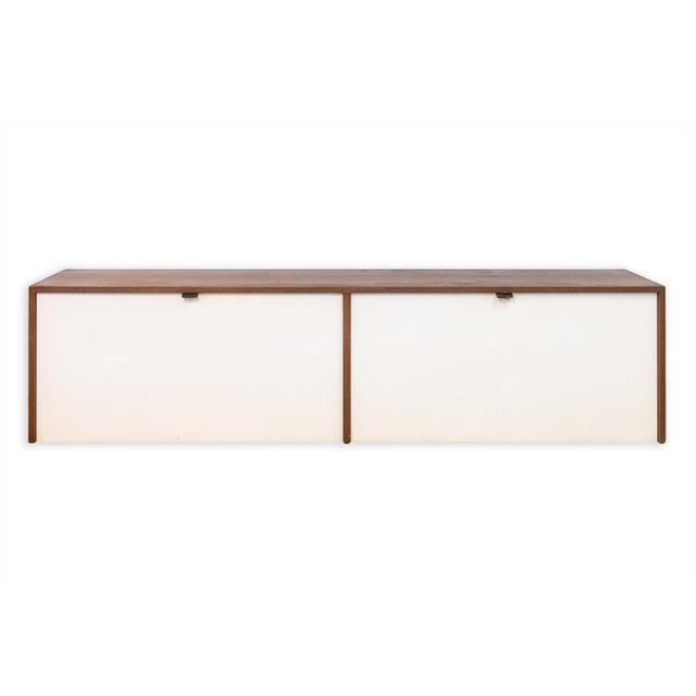 A pair of vintage 1960s Florence Knoll floating credenza cabinets. This is a beautiful set of classic mid century modern...