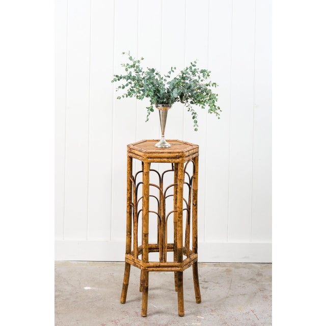 This antique octagon bamboo stand features six bent bamboo legs, decorative arched supports connecting the legs, and a...