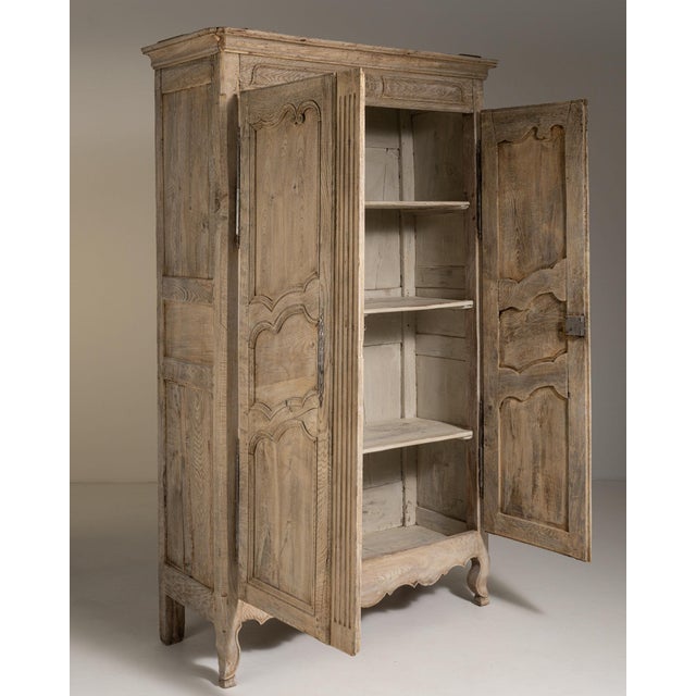 This piece presents as a cabinet, distinguished by natural weathered oak, carved shaped panel. Dating to Early 19th...