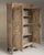 This piece presents as a cabinet, distinguished by natural weathered oak, carved shaped panel. Dating to Early 19th...