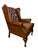 Vintage English wingback armchair in cognac-brown leather with deep-button tufting and nailhead trim. Featuring Queen Anne...