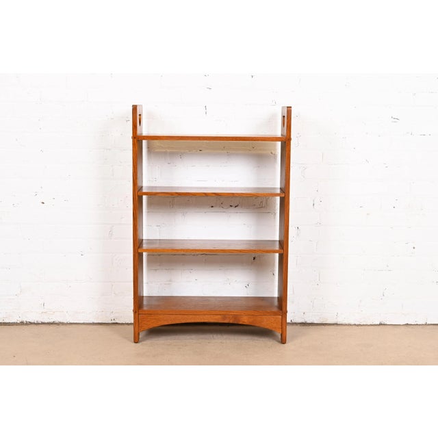 An exceptional Mission or Arts & Crafts style solid oak bookcase By L. & J.G. Stickley USA, 2012 Measures: 26.25"W x 10"D...