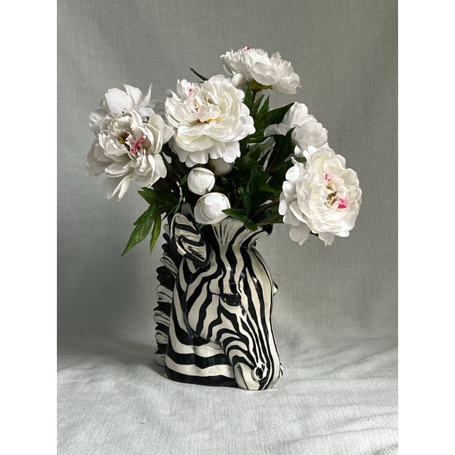 Large vintage c1980s ceramic black and white zebra head vase. Measures approximately 10” wide, 8.5” deep and 11” tall. In...