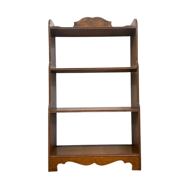 Infuse your home with classic warmth and storied charm with this beautiful vintage four-tier solid wood bookshelf....