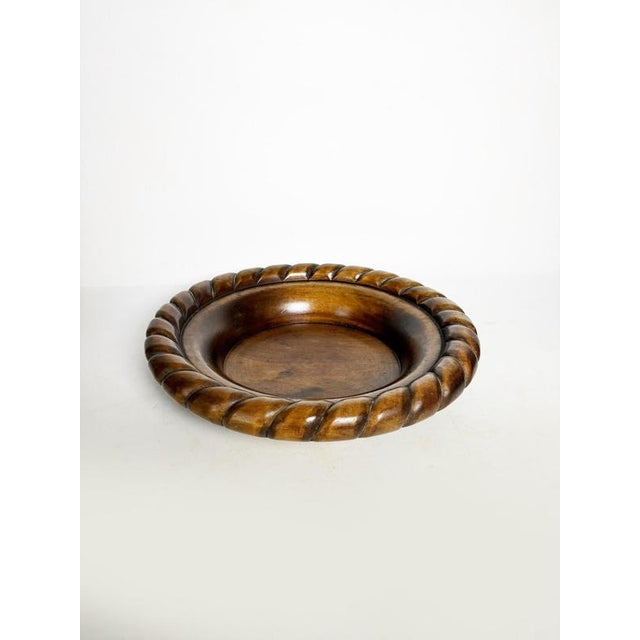 Wooden trinket tray, France, 1950s, with an elegant and inviting design. This circular piece is distinguished by its...