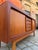 Scandinavian craftsmanship at its finest: This mid-century sideboard, crafted from exquisite teak and designed by...