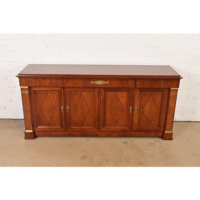 A gorgeous French Empire or French Regency Louis XVI style sideboard, credenza, or bar cabinet By Baker Furniture USA,...