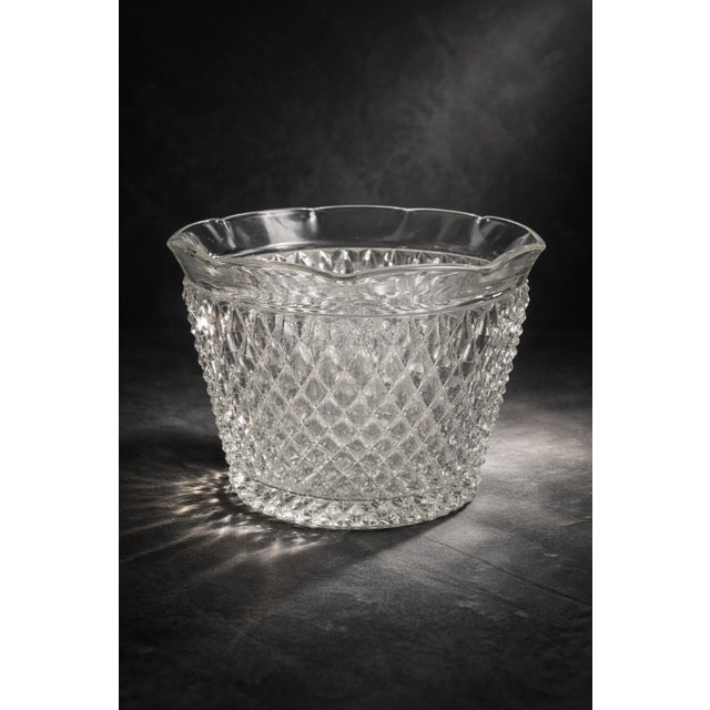 A substantial vintage pressed glass ice bucket or catchall bowl featuring a classic diamond hobstar pattern and scalloped...