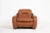 Italian mid-century modern sculptural armchair in brown cognac leather, produced in 1960's. Condition Fair, age related...