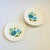 A set of 6 mid century ceramic dinner plates by American Ironstone. Glossy white glaze with a pattern of blue flowers on...