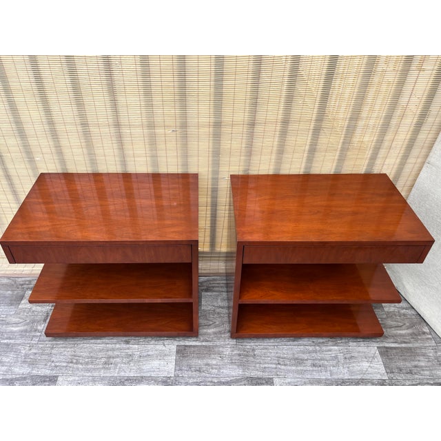 A Pair of Walnut Nightstands by Ralph Lauren Modern Hollywood Home Collection. Features a modern take on classic...
