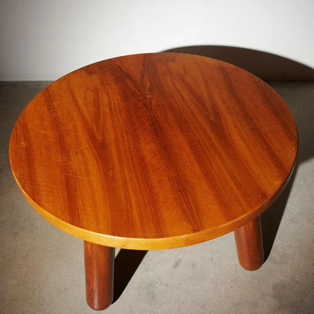 Circular coffee table of nutwood with solid legs of stained elm. This example made 1940s by cabinetmaker Otto Færge. I...