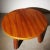 Circular coffee table of nutwood with solid legs of stained elm. This example made 1940s by cabinetmaker Otto Færge. I...