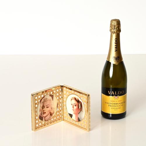 Delightful picture frame made of golden brass and clear lucite, enriched with Vienna straw. This lovely folding frame is...