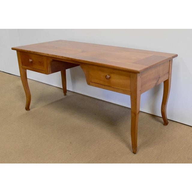Long regional desk from northern Nantes in cherry wood, consisting of a top with a wide frame and a central section made...