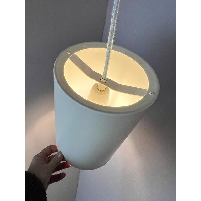 This cylindrical lamp is a minimalist design from Fog & Mørup. The model impresses with its clean, geometric lines,...