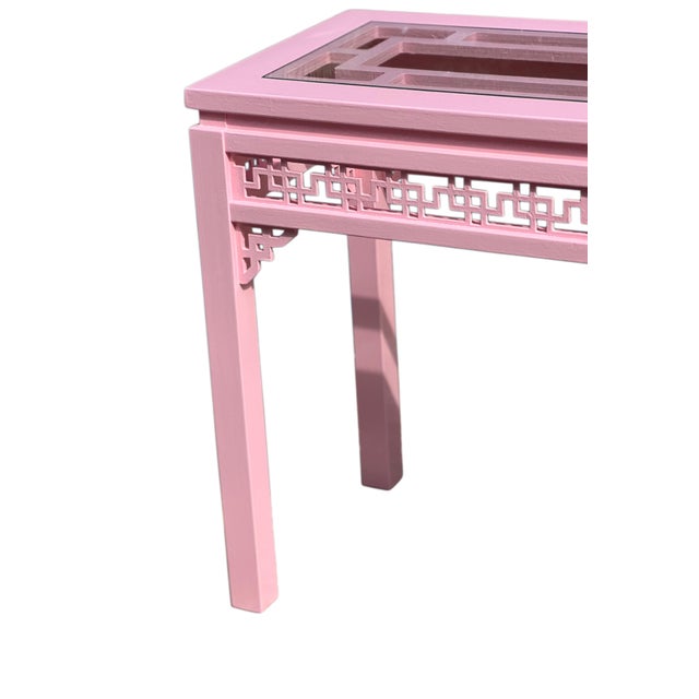 Pink painted vintage console table. Inset glass panels/clear NOT tinted. Intricate fretwork apron on all four sides....