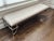 Hammered Champagne Silver Bench with Faux Snakeskin Upholstery Elegant and sculptural bench featuring a hand-hammered...