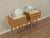 Charming bedside tables from the 1950s. Ash veneer frames, each with two drawers and angled legs. The tops are covered...