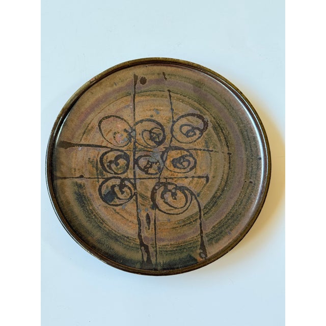 Beautiful, slip decorated studio pottery shallow bowl (or deep plate-as you choose) by Eric Norstad. Mid 20th century....