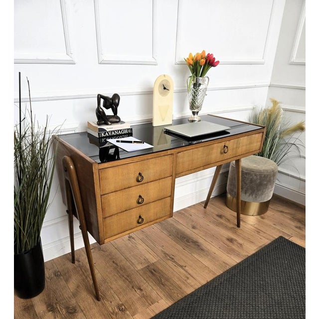 Beautiful Italian Mid-Century Modern desk writing table, in wood with very elegant refined side legs, black glass top and...