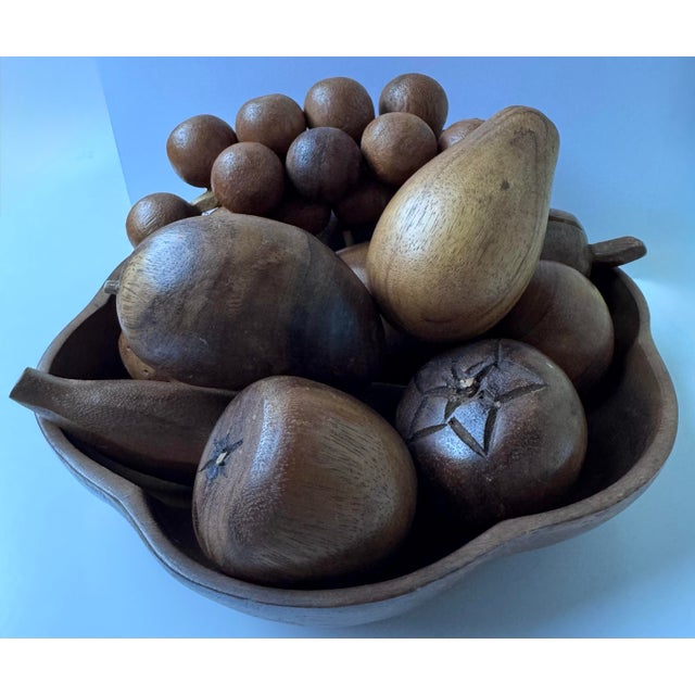Elevate your tabletop with this exceptional mid-century modern hand-carved monkey pod wood fruit centerpiece set. Dating...