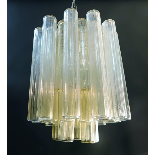Vintage Italian chandelier with clear and yellow amber Murano glass tubes / made in Italy, circa 1960s in the style of...