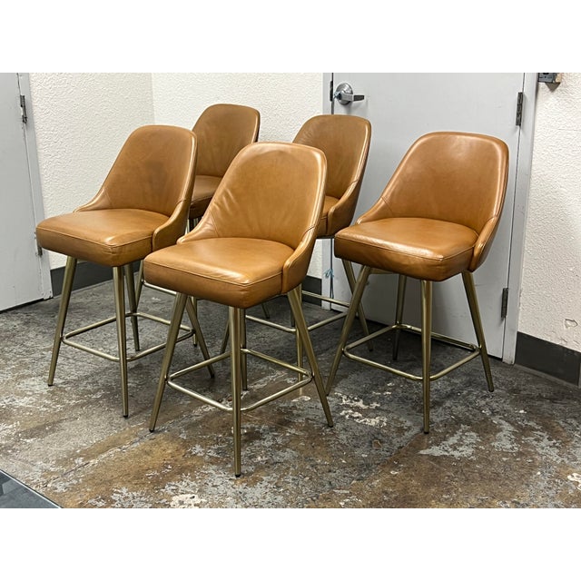 Design Plus Gallery presents a Set of Five Mid Century Swivel Stools from West Elm. Presents timeless mid-century design...