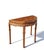 This semi-circular accent table, known as a yanyuezhuo or "half-moon" table, is made from solid elm with a rich, warm...