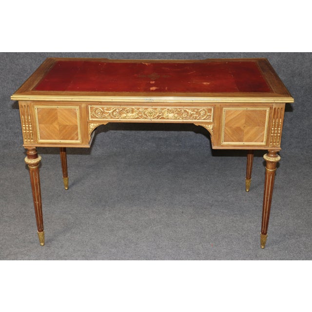 This magnificent late 19th century French Louis XVI style bureau plat is a superb example of the elegance, refinement, and...