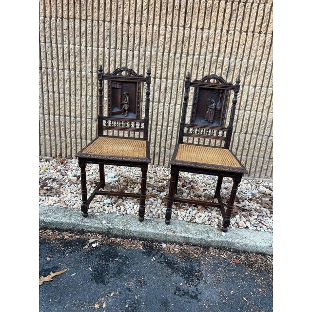 Pair Of Antique French Renaissance Style Carved Cane Seat Brittany Side Chairs. Circa late 19th century to early 20th...