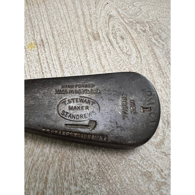 Antique hand-forged golf club made by Tom Stewart of St. Andrews, Scotland, featuring his iconic pipe trademark. Tom...