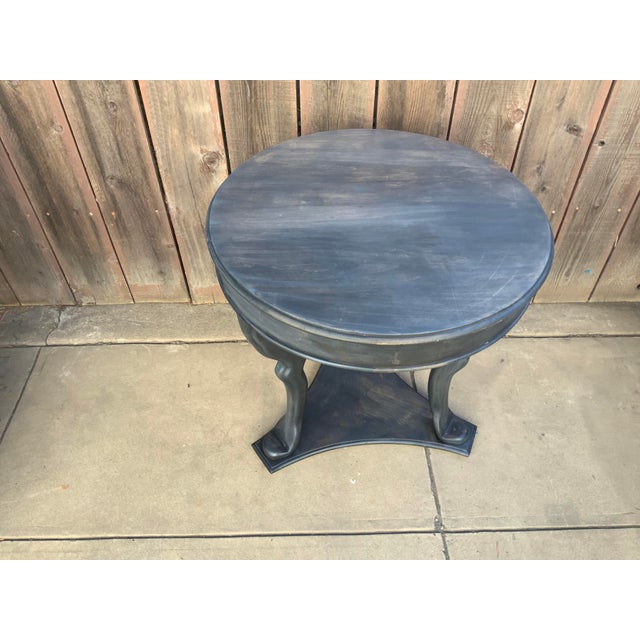 Modern shabby chic end table with crude blue/grey finish. Table has a unique look and feel with contemporary look and...