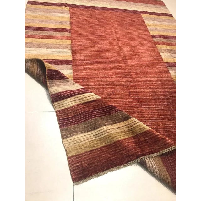 This rug was handwoven in wool on a cotton frame.