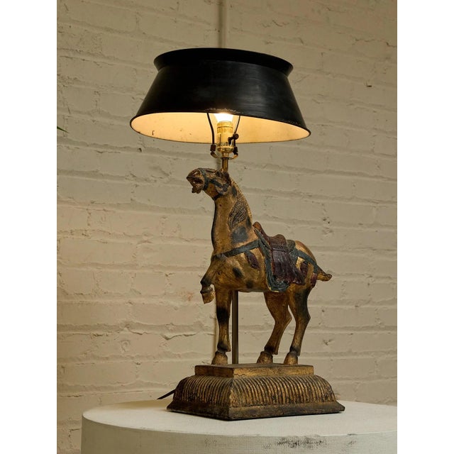 A wonderfully distinctive vintage table lamp featuring a sculptural horse figure as its centerpiece. The richly detailed...
