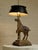 A wonderfully distinctive vintage table lamp featuring a sculptural horse figure as its centerpiece. The richly detailed...