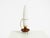 A beautiful, large mid-century modern tripod table lamp. Crafted from brass and teak, featuring a long milk glass shade. a...