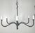 This six light chandelier has a minimalist and elegant design, crafted from wrought iron. It features six arms, extending...