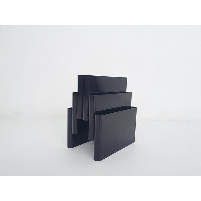 Black plastic magazine stand by Giotto Stoppino for Kartell. Marked at the bottom Giotto Stoppino This piece is attributed...