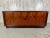 Rare Danish modern rosewood tambour door credenza with center dovetailed drawer section and adjustable shelf on each side.