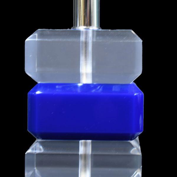 A pair of blue and lucite table lamps, their compact cube-like forms glowing with color through clear acrylic. Petite at...
