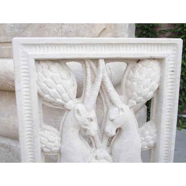 Hand-carved in Italy, this limestone plaque depicts a pair of rampant ibex in front of an expansive grapevine. This scene...