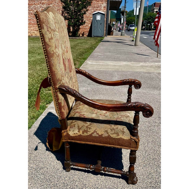 This is an impressive fine quality tall back and deep seated throne chair with elegant flowing arms and a beautiful carved...
